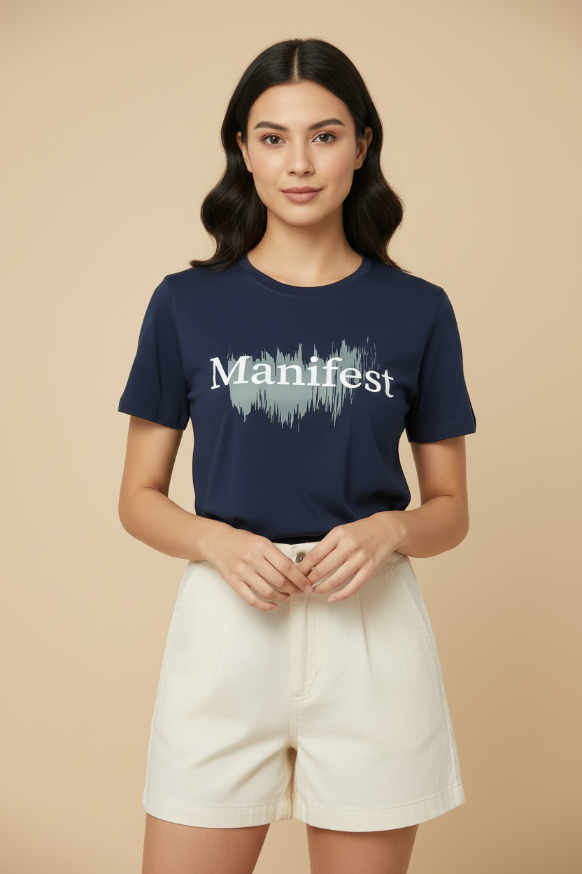 Model wearing navy blue Manifest t-shirt with face visible